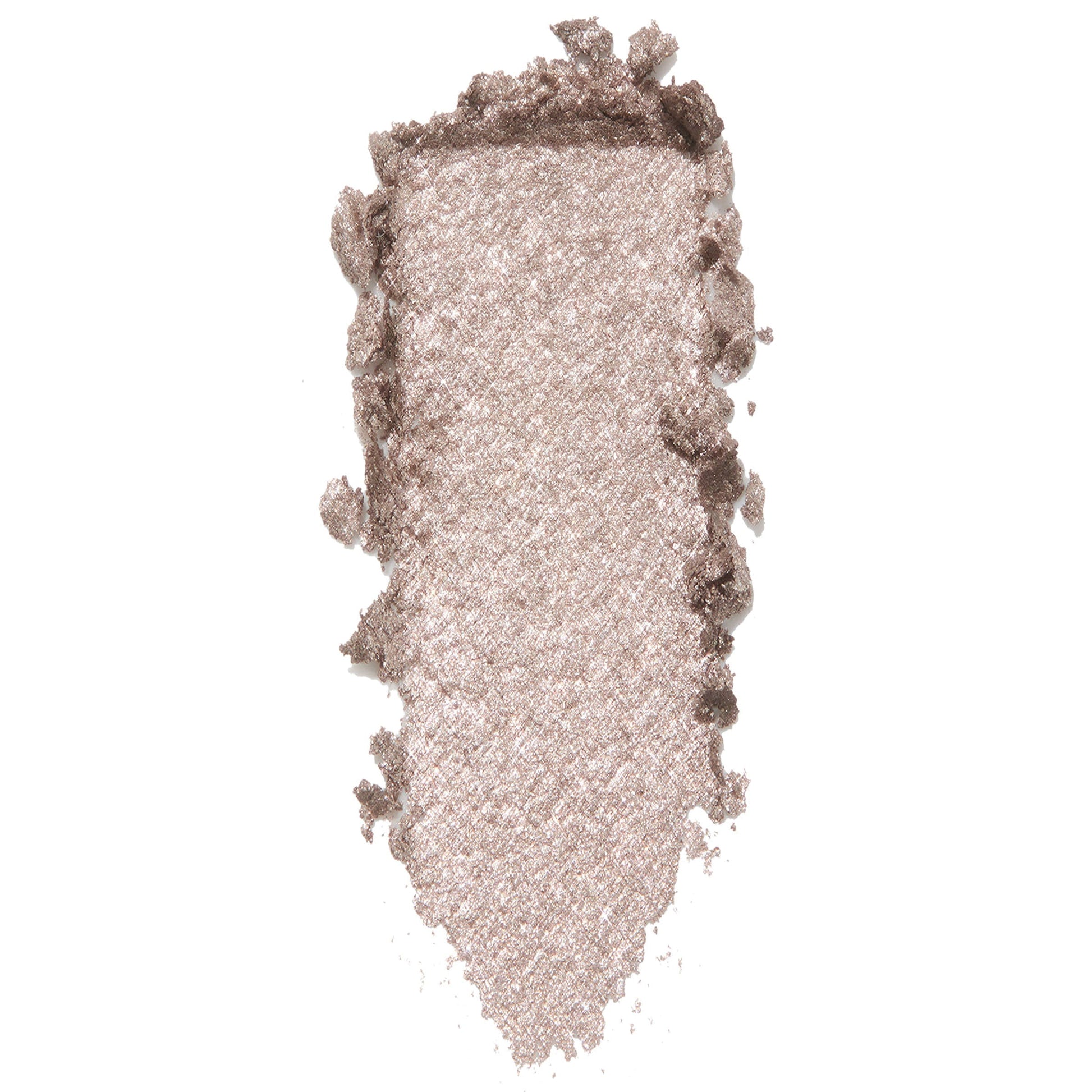 ColourPop I Heart This Super Shock Shadow swatch, a metallic champagne‑taupe with silver glitter, shown as a thick vertical smear with textured, crumbled edges on a white background to highlight its high-shine finish.