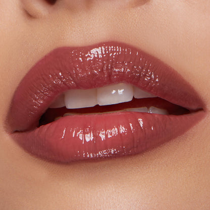 Glossy, plumped pink‑mauve lips softly parted, lined and filled with Glazed Pout from the ColourPop So Juicy Plumping Lip Liner & Balm Set, shown in a studio close‑up to highlight high‑shine finish, smooth texture, and precise definition.